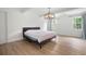 Spacious bedroom with hardwood floors, ample light and ceiling with exposed beams at 4920 Hampton Lake Dr, Marietta, GA 30068