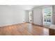Bright bedroom with hardwood floors and sun-filled windows overlooking lush yard at 4920 Hampton Lake Dr, Marietta, GA 30068