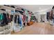 Large walk-in closet features hardwood flooring, built-in storage, and natural light at 4920 Hampton Lake Dr, Marietta, GA 30068