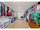 Spacious walk-in closet with custom shelving, storage, and laundry facilities at 4920 Hampton Lake Dr, Marietta, GA 30068