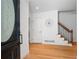 Welcoming foyer with hardwood floors, staircase, and elegant decor creating a warm entry at 4920 Hampton Lake Dr, Marietta, GA 30068