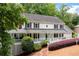 Charming two-story home featuring a classic design, inviting front porch, and a manicured lawn at 4920 Hampton Lake Dr, Marietta, GA 30068