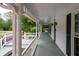 Spacious wraparound porch offering a relaxing outdoor space with views of the landscaped yard at 4920 Hampton Lake Dr, Marietta, GA 30068