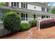 Close up of home showcasing well-manicured landscaping and charming details of the front porch at 4920 Hampton Lake Dr, Marietta, GA 30068