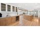 Spacious kitchen boasts custom cabinets, wine cooler, stainless appliances, and large island with sink at 4920 Hampton Lake Dr, Marietta, GA 30068