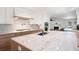 Well-appointed kitchen featuring a large island with white marble and stainless steel appliances at 4920 Hampton Lake Dr, Marietta, GA 30068