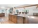 Bright and airy kitchen with an island, stainless steel dishwasher, and custom wood cabinets at 4920 Hampton Lake Dr, Marietta, GA 30068