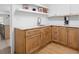 Convenient kitchenette with wooden cabinets, marble countertops, and open shelving at 4920 Hampton Lake Dr, Marietta, GA 30068