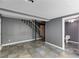 Large basement with tile flooring, staircase, and a door to the bathroom at 4985 Watkins Ct, Winston, GA 30187