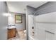 Well-lit bathroom with a shower and single sink vanity provides all the comforts you need at 4985 Watkins Ct, Winston, GA 30187