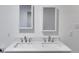 Bathroom features a double vanity with white countertops and modern fixtures at 4985 Watkins Ct, Winston, GA 30187