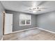 Clean bedroom featuring updated flooring and large window views at 4985 Watkins Ct, Winston, GA 30187