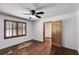 Bedroom featuring hardwood floors, neutral walls and a wooden door at 4985 Watkins Ct, Winston, GA 30187