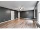 Hardwood floors and modern ceiling fan accent the living area at 4985 Watkins Ct, Winston, GA 30187