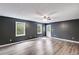 Bright living room boasts hardwood floors, neutral paint, and abundant natural light at 4985 Watkins Ct, Winston, GA 30187