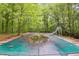 Backyard pool covered with leaves, surrounded by greenery at 4985 Watkins Ct, Winston, GA 30187
