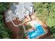 Aerial view of home with pool, deck, and outdoor entertaining spaces at 206 Kingsley Way, Woodstock, GA 30188