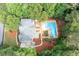 Aerial view of the home featuring a pool, outdoor dining, and lounging at 206 Kingsley Way, Woodstock, GA 30188