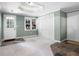 Basement room with tiled floor near the doors and a large window and closet space at 206 Kingsley Way, Woodstock, GA 30188
