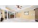 An open basement layout showcases neutral paint, a decorative ceiling, and convenient access to the bar and other areas at 206 Kingsley Way, Woodstock, GA 30188