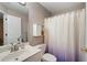 Bathroom featuring single sink vanity, and shower/tub combo with patterned shower curtain at 206 Kingsley Way, Woodstock, GA 30188