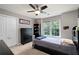 Comfortable bedroom with double bed, large window, ceiling fan and neutral wall color at 206 Kingsley Way, Woodstock, GA 30188