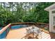 Outdoor deck offering a delightful space for al fresco dining and poolside relaxation at 206 Kingsley Way, Woodstock, GA 30188