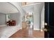 Elegant foyer with hardwood floors, archways, and view of the living and dining areas at 206 Kingsley Way, Woodstock, GA 30188