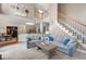 Bright living room offering neutral furniture, open floor plan, second story view, and hardwood floors at 206 Kingsley Way, Woodstock, GA 30188