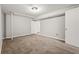 Finished basement space with carpeted floors and multiple doorways at 2519 Lauderdale Ne Dr, Atlanta, GA 30345