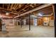 Unfinished basement with exposed ceiling, concrete floors, and appliances at 2519 Lauderdale Ne Dr, Atlanta, GA 30345