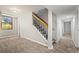 Finished basement featuring carpeted floors, stairs, and natural light from a window at 2519 Lauderdale Ne Dr, Atlanta, GA 30345