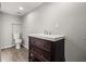 Bathroom with a vanity sink and toilet over wood-look flooring at 2519 Lauderdale Ne Dr, Atlanta, GA 30345