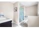 This bathroom is well lit and features a shower, tub and vanity at 2519 Lauderdale Ne Dr, Atlanta, GA 30345