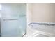 This bathroom features a tub and enclosed shower with a glass door at 2519 Lauderdale Ne Dr, Atlanta, GA 30345