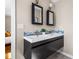 This modern bathroom features double sinks and a gray vanity at 2519 Lauderdale Ne Dr, Atlanta, GA 30345