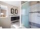 This updated bathroom features double sinks, a modern vanity, and a walk-in shower at 2519 Lauderdale Ne Dr, Atlanta, GA 30345