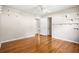 Spacious bedroom with hardwood floors, ceiling fan and shelving for ample storage at 2519 Lauderdale Ne Dr, Atlanta, GA 30345