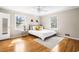 Bright bedroom features hardwood floors, neutral paint, windows, and a ceiling fan at 2519 Lauderdale Ne Dr, Atlanta, GA 30345