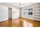 Bedroom featuring hardwood floors, shelving and a window offering natural light at 2519 Lauderdale Ne Dr, Atlanta, GA 30345