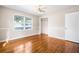 This bedroom features hardwood floors, natural light, and closet at 2519 Lauderdale Ne Dr, Atlanta, GA 30345