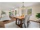 Dining room features hardwood floors, modern lighting, and comfortable seating for four at 2519 Lauderdale Ne Dr, Atlanta, GA 30345