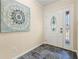 Inviting foyer featuring decorative front door with leaded glass sidelight and slate tile flooring at 2519 Lauderdale Ne Dr, Atlanta, GA 30345