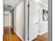 Hallway featuring hardwood floors, neutral paint, and white doors for a clean and inviting space at 2519 Lauderdale Ne Dr, Atlanta, GA 30345