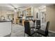 Updated kitchen features stainless appliances, modern cabinets, and a breakfast nook with a glass table at 2519 Lauderdale Ne Dr, Atlanta, GA 30345