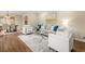 Spacious living room with hardwood floors, neutral paint, and view of the dining area at 2519 Lauderdale Ne Dr, Atlanta, GA 30345