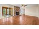 Living room with a brick fireplace and hardwood floors leads to a bright sunroom for relaxation and enjoyment at 2519 Lauderdale Ne Dr, Atlanta, GA 30345