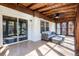 Enclosed sunroom with wicker furniture, ceiling fan, and large windows offering natural light and backyard views at 2519 Lauderdale Ne Dr, Atlanta, GA 30345