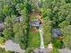 An aerial view of a home showcasing the property's large lot and surrounding trees at 2885 Laurel Green Ct, Roswell, GA 30076