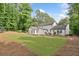 Spacious backyard with mature trees, manicured lawn, and patio at 2885 Laurel Green Ct, Roswell, GA 30076